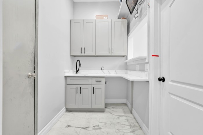 Wider view of the pantry showing counter space and the pass-through window