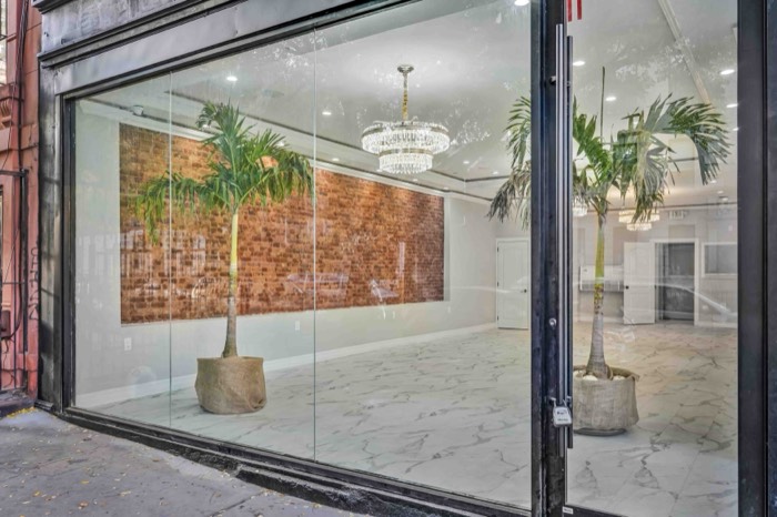 View into the venue through the corner glass frontage from the sidewalk